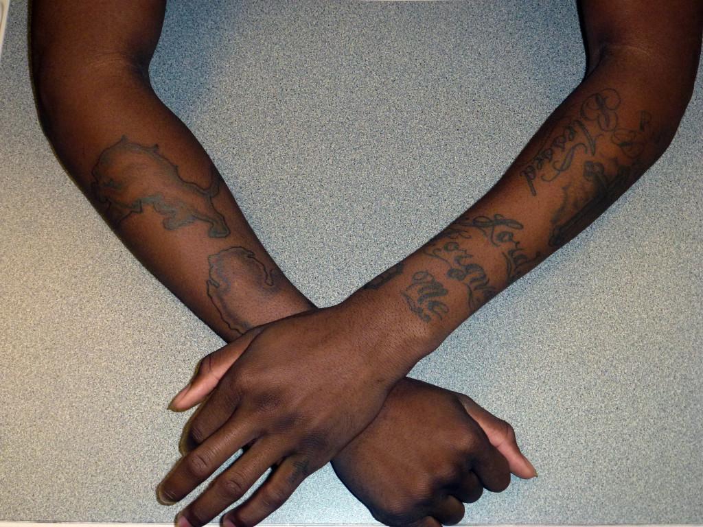 Ink spot: The right arm of senior Rayshaun Bradley features a Detroit Lions logo and the outline of the State of Michigan. Photo by Eric Scott