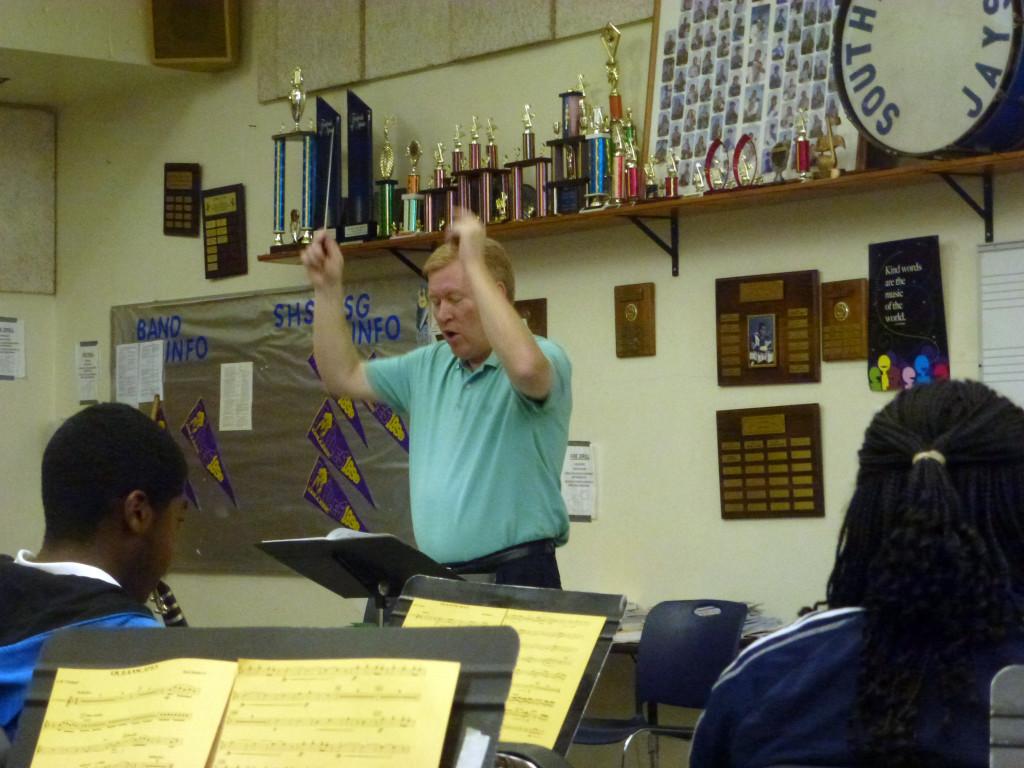 Music man:  The beat goes on in the band room with Alan Warmanen , who started in September as the new band teacher.  David Miller, son of  retired Band Director Thomas Miller, is now directing the Marching Band. 