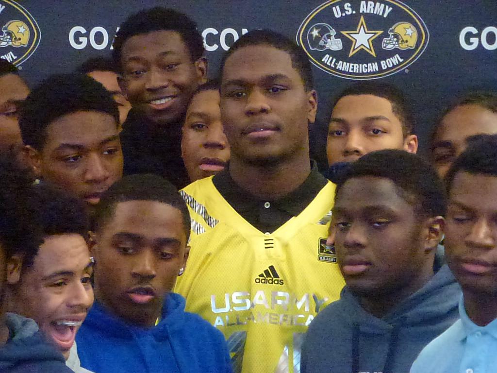 Fan Favorite: Schoolmates surround senior Malik McDowell at Southfield High as he is named to the United States Armys All-American football team.