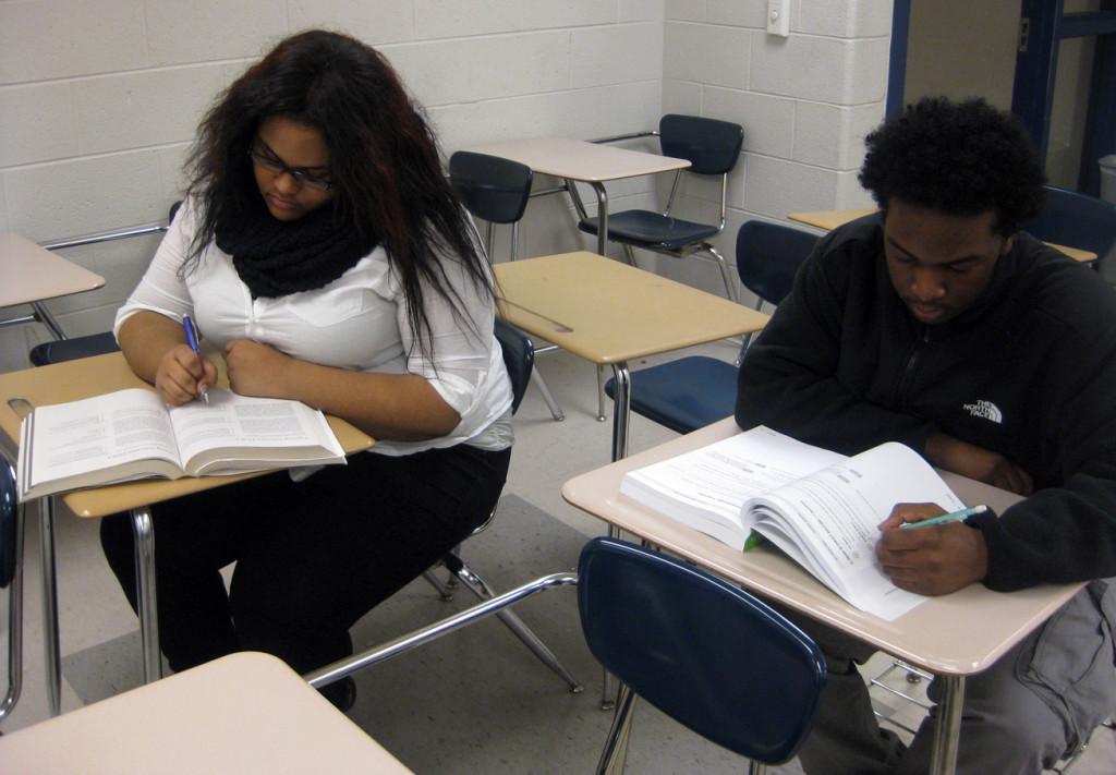 Juniors Tiffany Harris (left) and Darian Fountain work in their Kaplan ACT books. They are preparing to take the ACT on March 7.