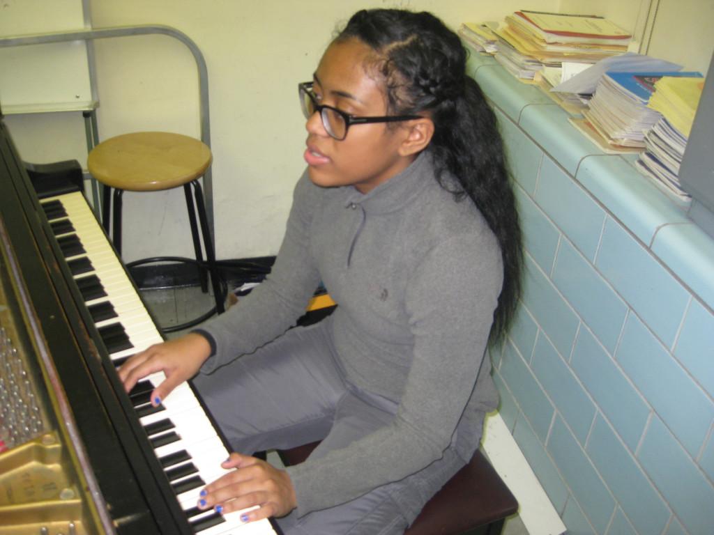 American Dream: Junior Malaya Watson plays the piano in Southfield High Schools band room. She has made it through four cuts so far on American Idol with her singing voice. 