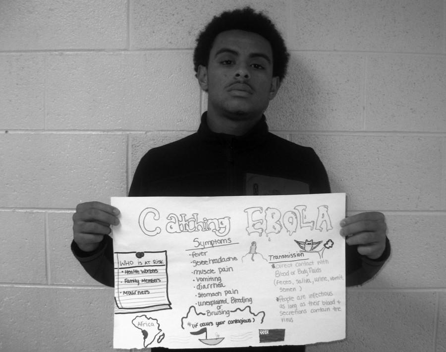 Poster child: Senior Joshua Stovall displays his Ebola project, which was a poster about contracting Ebola.