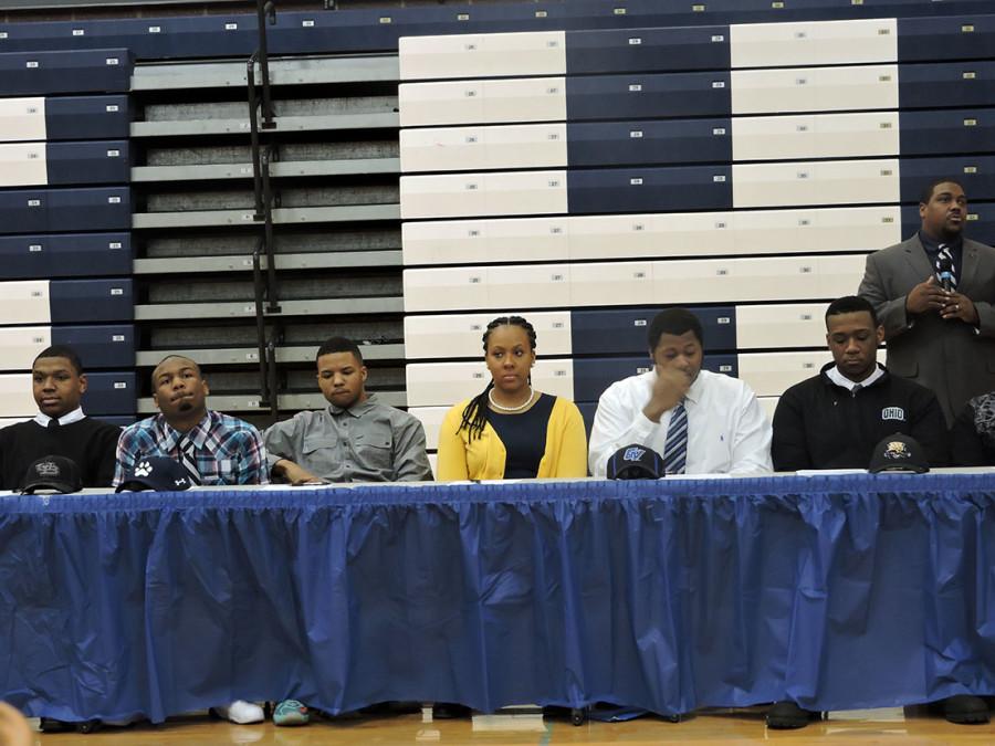 Assistant Principal Vernon Burden instructs the students as they begin to announce where they are going to attend. The athletes wait patiently to sign their letters of intent.  