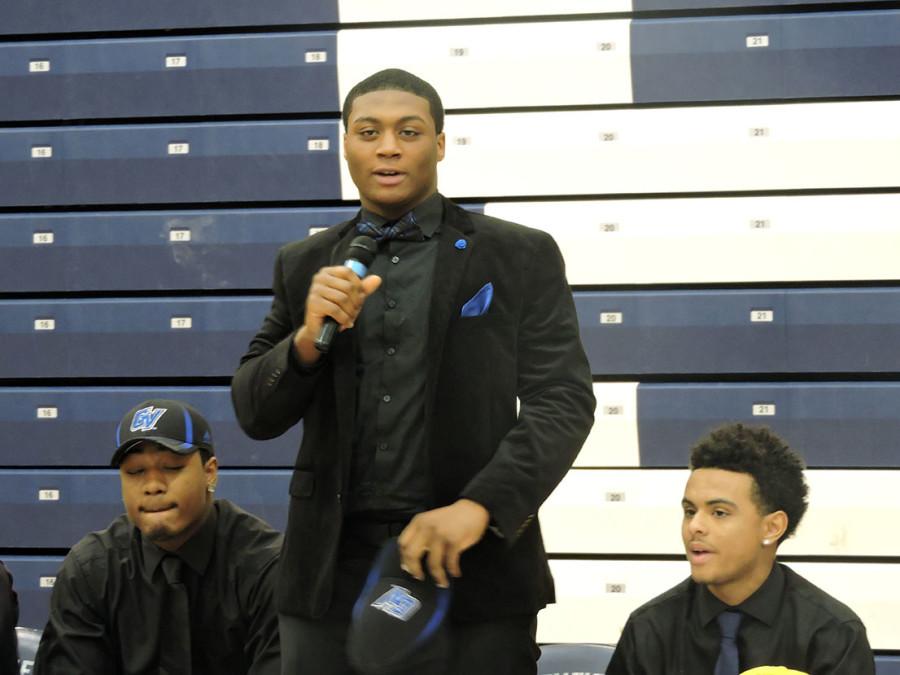 Senior Aaron Turner announces that he will be playing football for Grand Valley State University. Fellow  senior and football player Aaron Cooper (seated, with hat on) will join Turner at Grand Valley State University. 