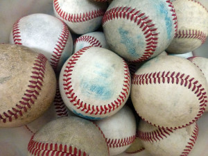 The bucket of practice baseballs sits quietly in Baseball Coach Andrew Greens classroom, waiting for the snow to melt.
