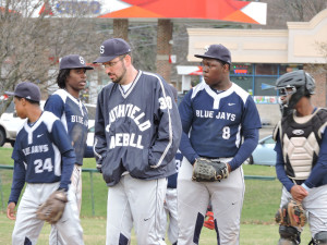 Baseball Coach Jamie Glinz (center) gets his players ready for the season.