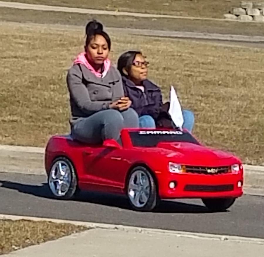 Drive Time: Senior Eiress Greenwood and sophomore Donna Dandridge rehearse a scene in their video against the dangers of texting while walking. A texter nearly walks in front of their miniature car during the video.