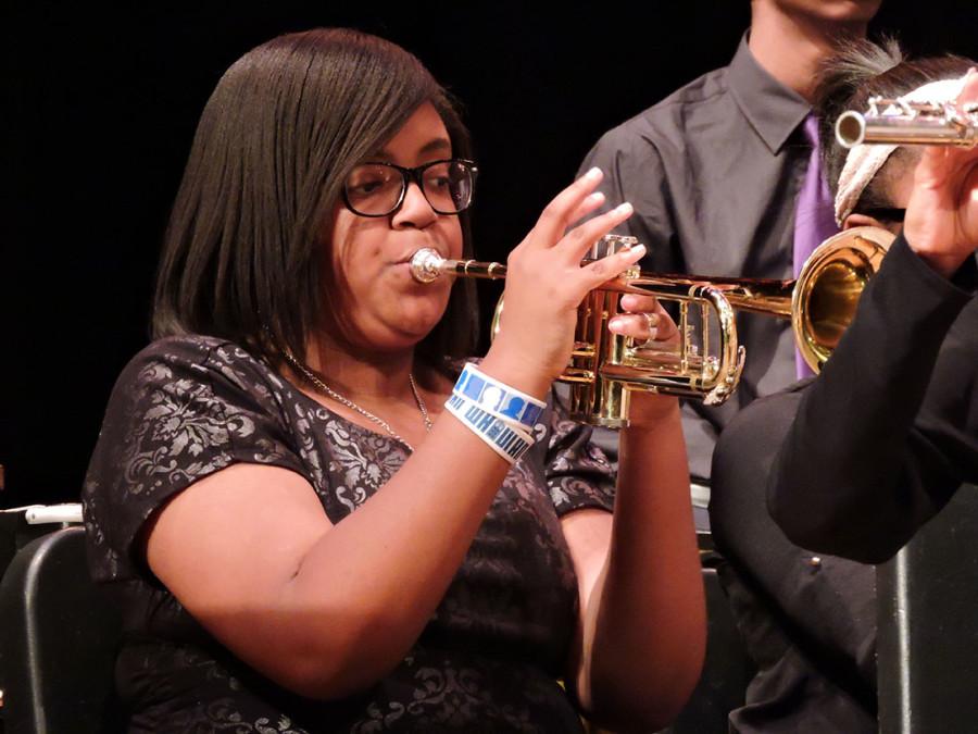 Freshman Kamryn Walker plays the trumpet during the Spring Extravaganza concert.