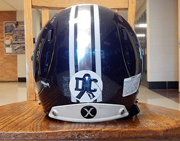 Seven senior football players are trading in their Blue Jay helmets for college football helmets.