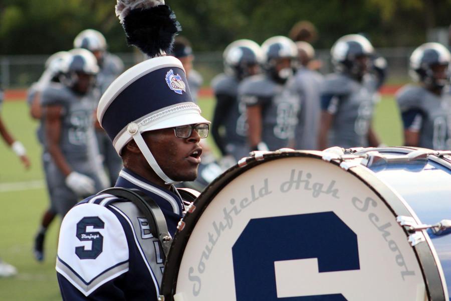 Senior+Darrius+Hicks+marches+to+the+beat+of+his+own+drum+during+the+halftime+at+the+North+Farmington+football+game.