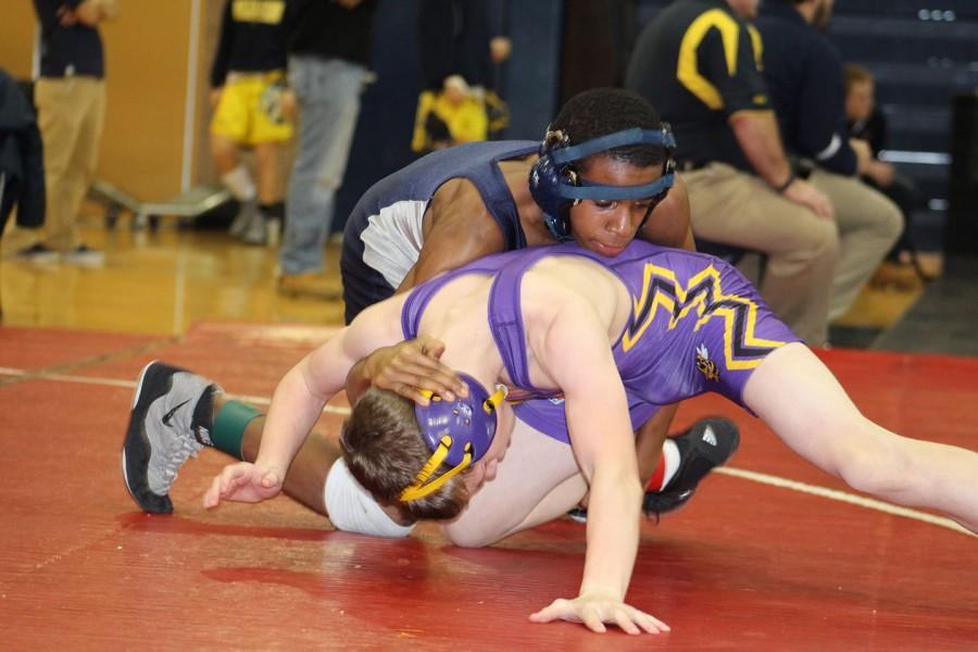 Andre Carter, wrestling in the 215-pound weight class, defeated his Ferndale High School opponent.