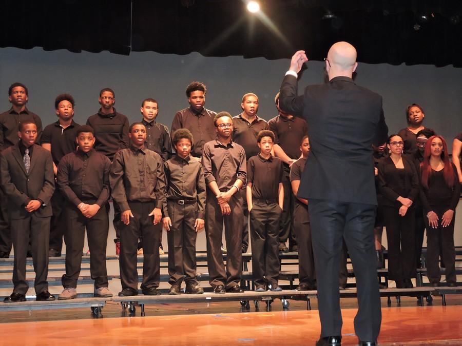 Under the direction of choir teacher Christopher Kuhn, students sing Lift Every Voice.