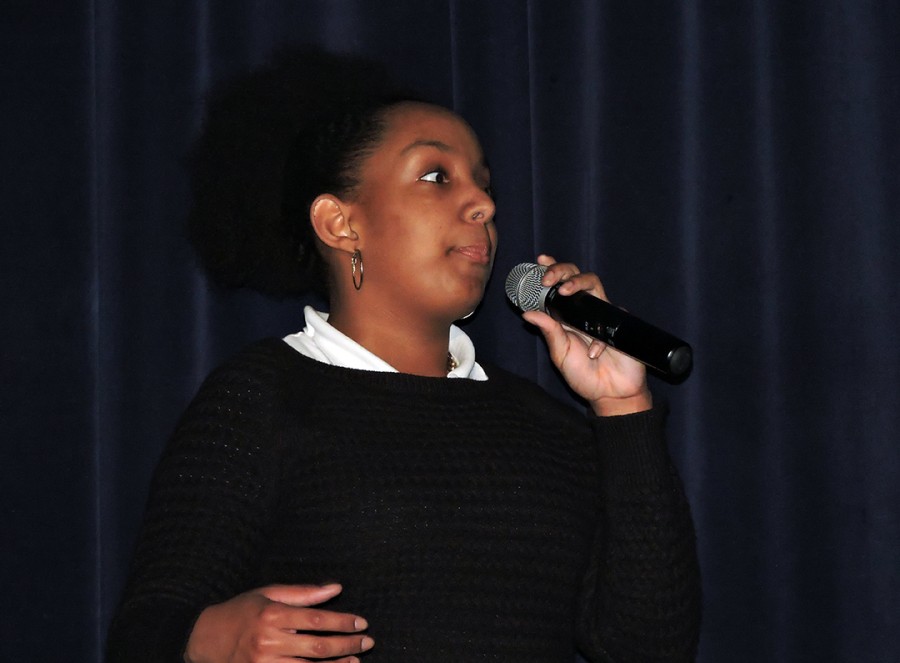 Sophomore Faron Davis presents her original poem called Crayons at the Black History Program. Her poem was about skin color.