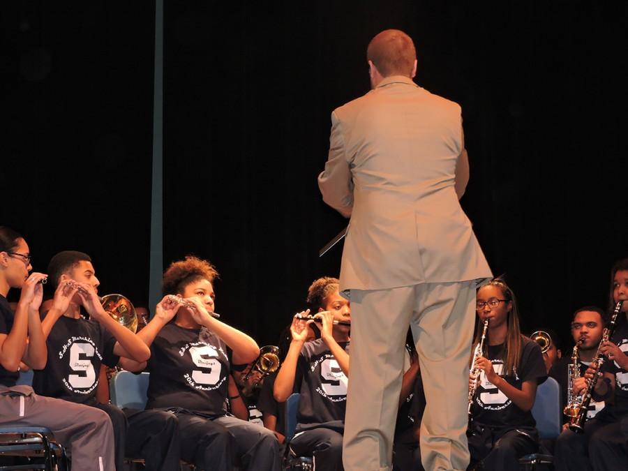 Marching Band Director David Miller leads his students in a performance of Order My Steps during the Black History program.