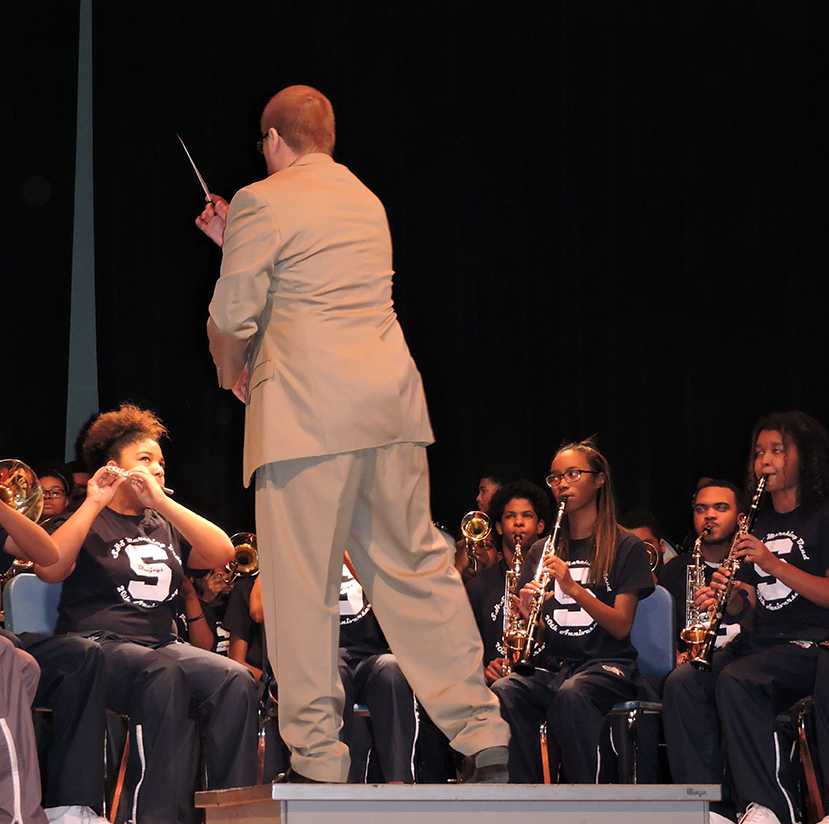 Band Director David Miller gets the wind section to perform during the Black History show.