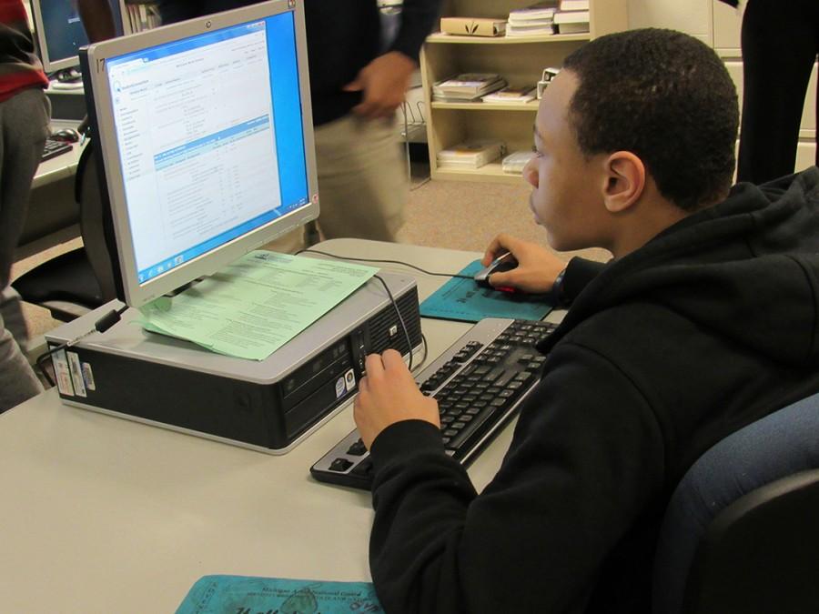 Sophomore Mark Dorsey practices for the SAT on the  Khan Academy free website.