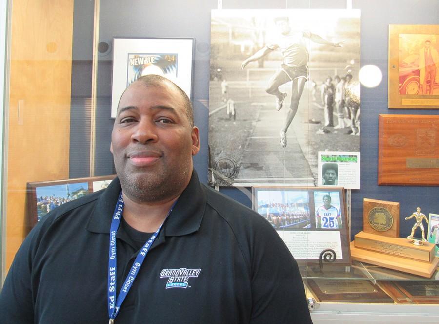 Finish Line: Retiring Coach Vincent Bean  stands in front of the school’s showcase filled with some of his years of awards for track, football and basketball when he was a high school student at Southfield High. Bean came back to teach at his alma mater.