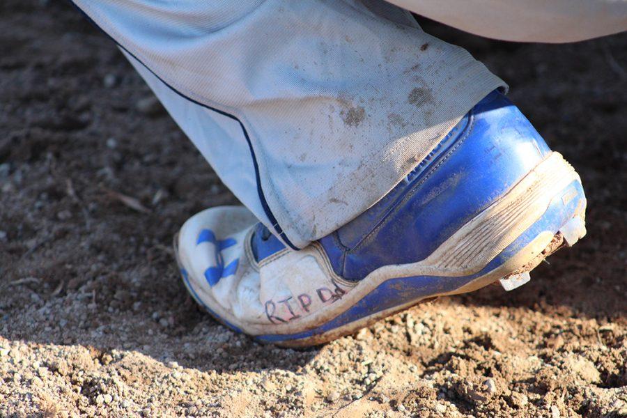 Sophomore pitcher Matthew Osborne pays tribute to his father on his baseball cleat.