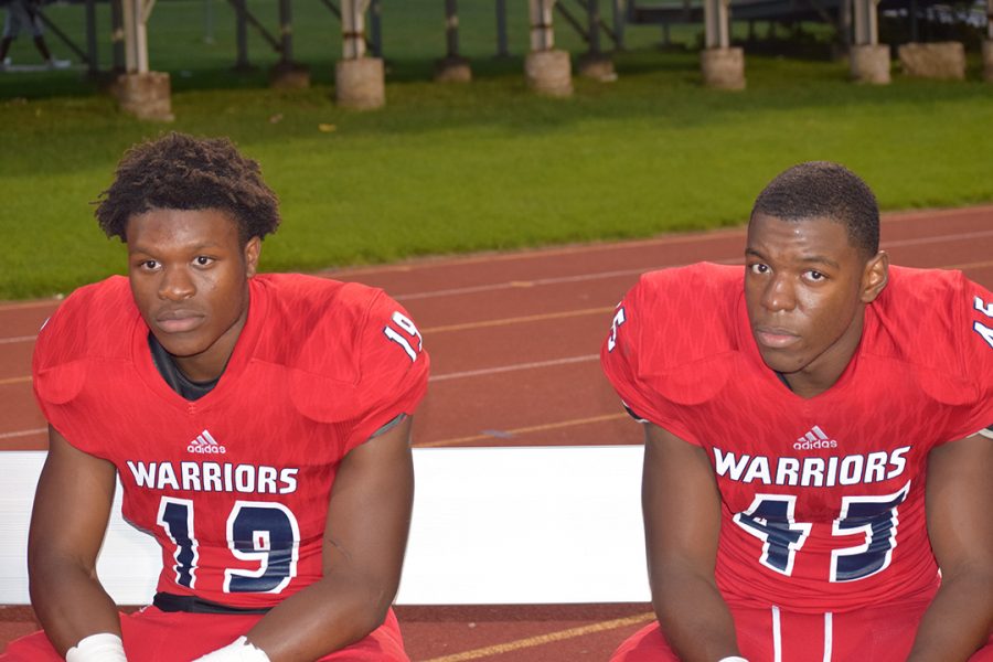 United: Now that the two rival high schools have merged, former Southfield-Lathrup junior linebacker Jeremy Pippen (left) finds himself teammates with former Southfield High senior defensive end Cardell Harris