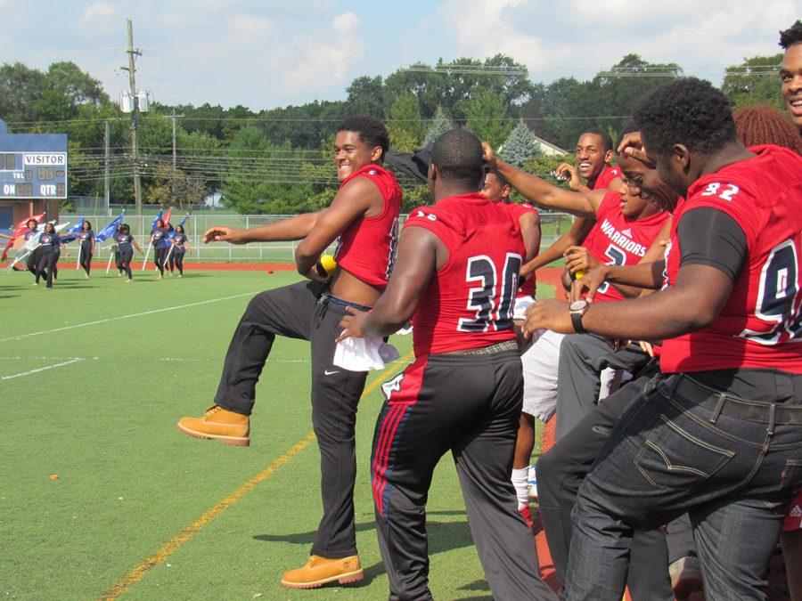 Football players led by junior Marshall Cry, dance to the beat. 