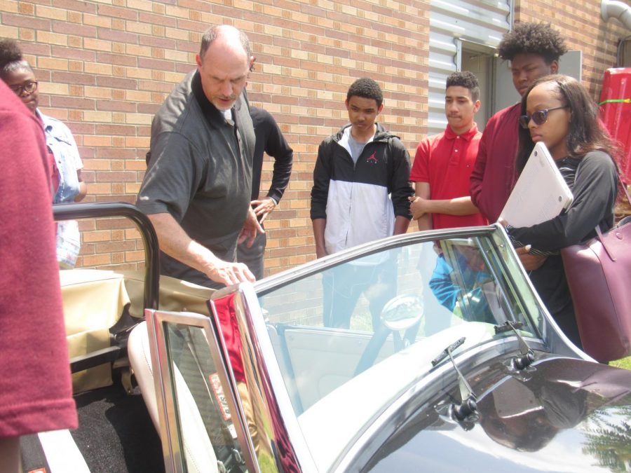 Students Interact While Mr. Martin Highlights Classic Cars